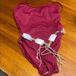 Burgundy one piece with shell belt